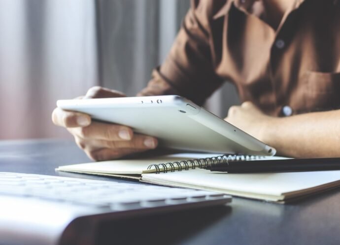 Businessman,Working,Tablet,In,Office,With,Film,Colors,Tone,,Soft-focus