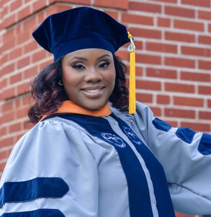 c-1758492178047-personal_1758492174124_1758492174124_drrhondasavain_rs-cap-and-gown-staircase